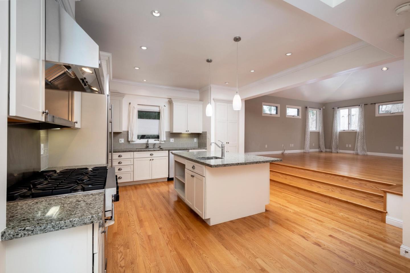 1508 Arc Way Burlingame, CA 94010 - Photo 8 of 18 a kitchen with stainless steel appliances granite countertop a stove a sink and a refrigerator