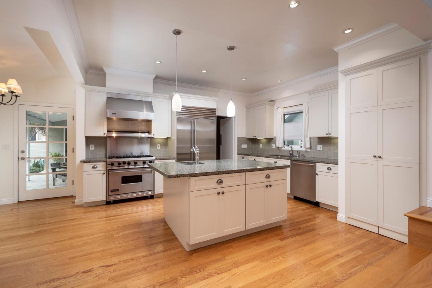 1508 Arc Way Burlingame, CA 94010 - Photo 10 of 18 a kitchen with stainless steel appliances a refrigerator sink and stove top oven