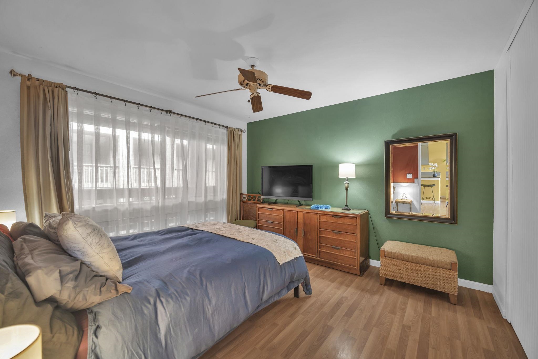 3740 Lower Honoapiilani Road, Unit C205 Lahaina, HI 96761 - Photo 14 of 28 a bedroom with a bed and a couch
