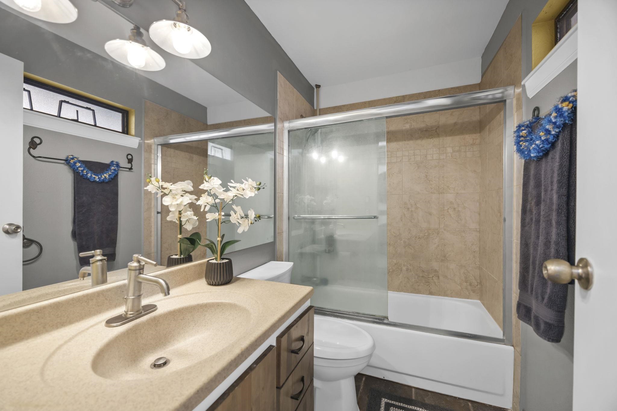 3740 Lower Honoapiilani Road, Unit C205 Lahaina, HI 96761 - Photo 15 of 28 a bathroom with a sink toilet and shower