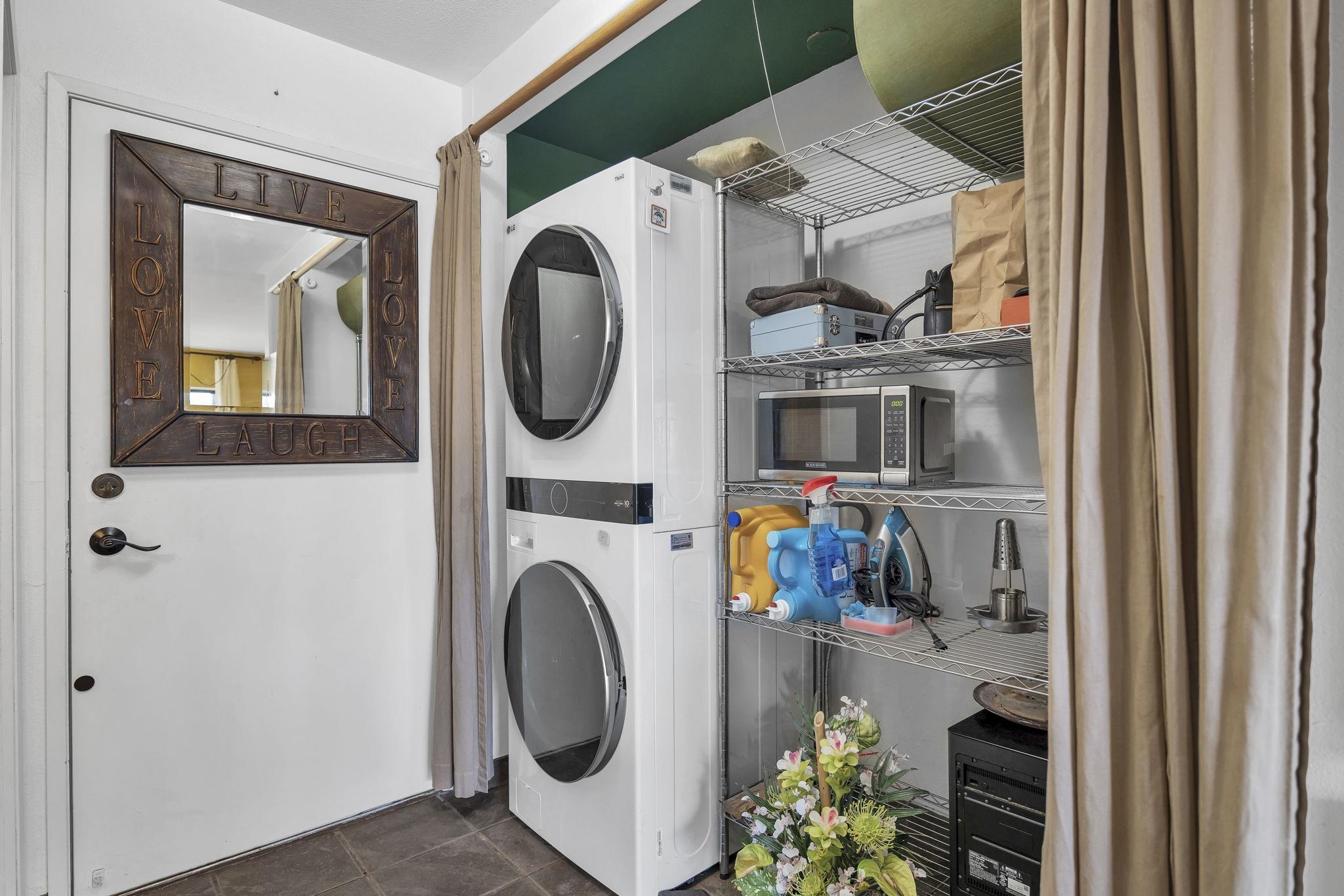 3740 Lower Honoapiilani Road, Unit C205 Lahaina, HI 96761 - Photo 16 of 28 a utility room with dryer washer and a view of living room