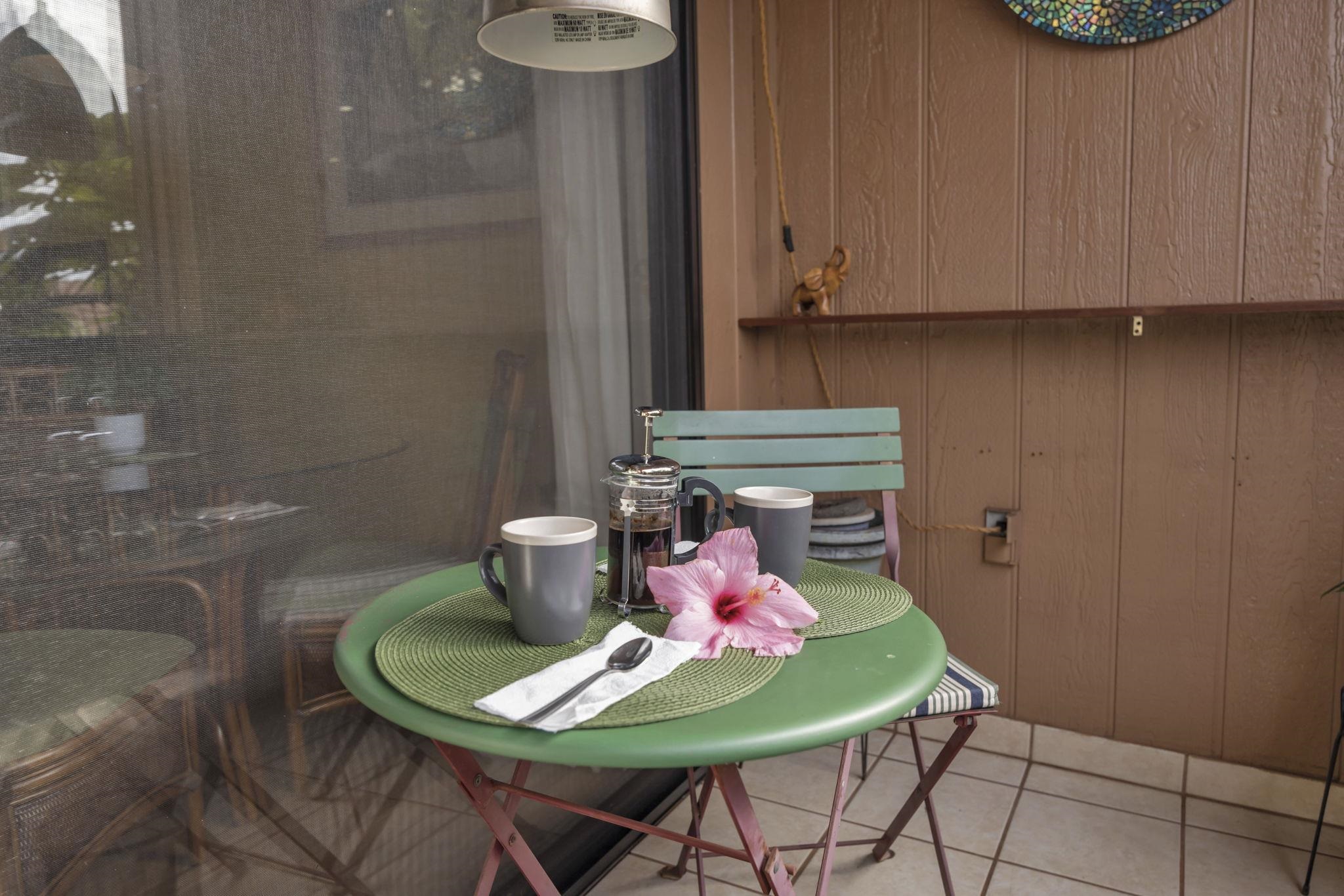 3740 Lower Honoapiilani Road, Unit C205 Lahaina, HI 96761 - Photo 20 of 28 a dining room with furniture and a potted plant