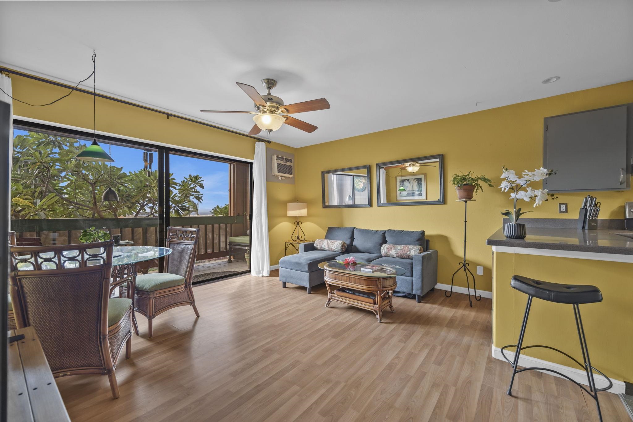 3740 Lower Honoapiilani Road, Unit C205 Lahaina, HI 96761 - Photo 3 of 28 a living room with furniture and a large window