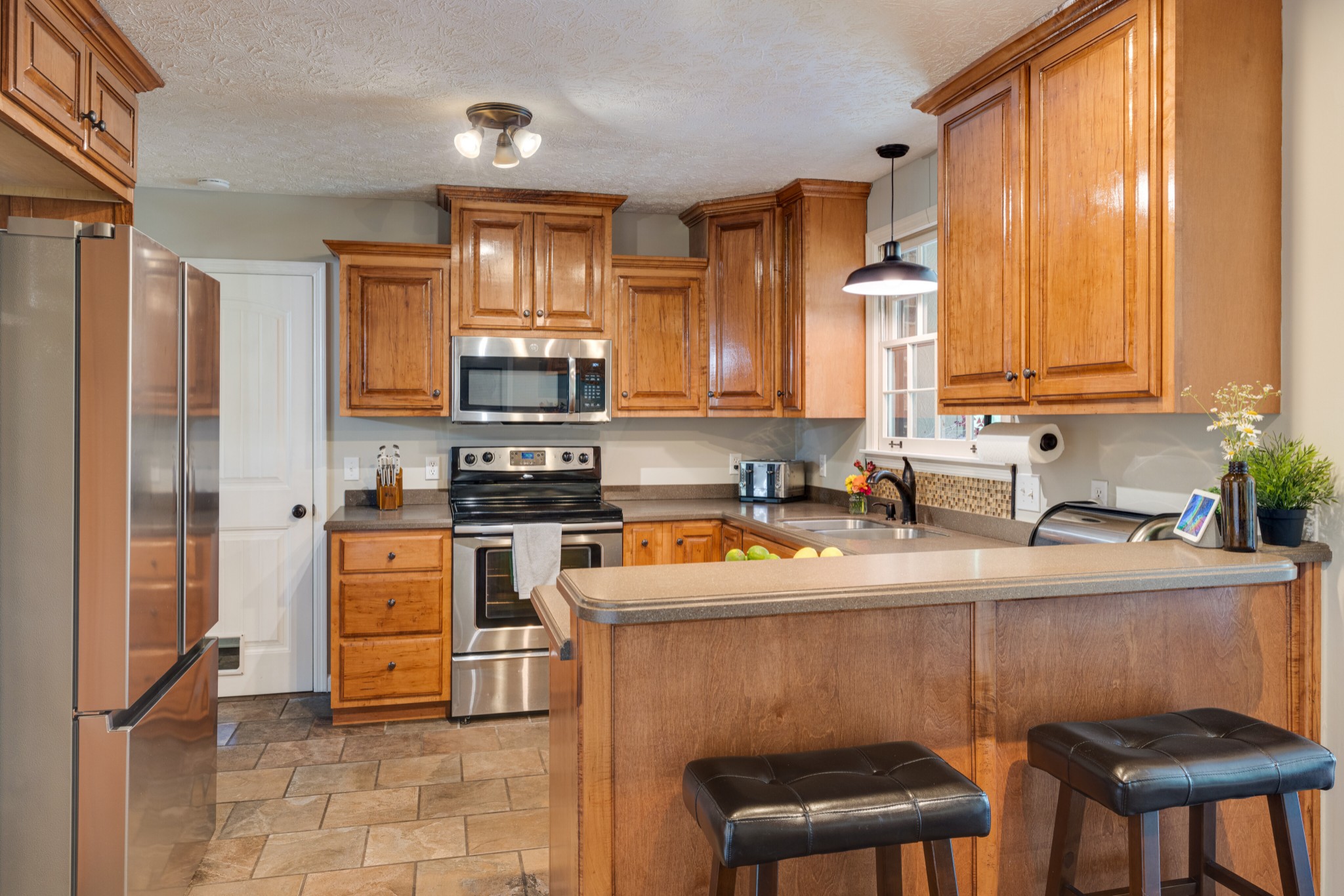 2535 Ewell Elliott Road Springfield, TN 37172 - Photo 8 of 36 a kitchen with stainless steel appliances granite countertop a stove a sink refrigerator and a microwave