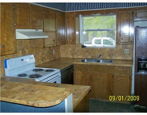 5007 Meandering Lane, Unit B Corpus Christi, TX 78413 - Photo 3 of 9 a bathroom with a sink and mirror