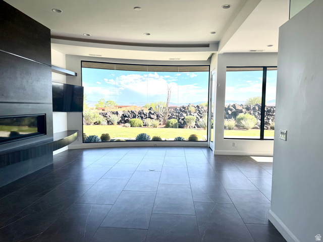 1500 Split Rock, Unit 150 Ivins, UT 84738 - Photo 5 of 18 Curved window wall showcasing exterior landscaping and distant hills