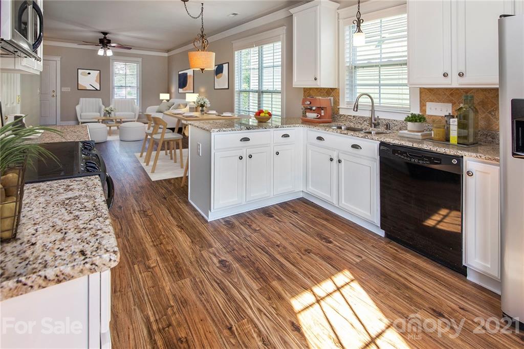 4255 Vance Road North Huntersville, NC 28078 - Photo 7 of 20 a kitchen with a sink stove and cabinets