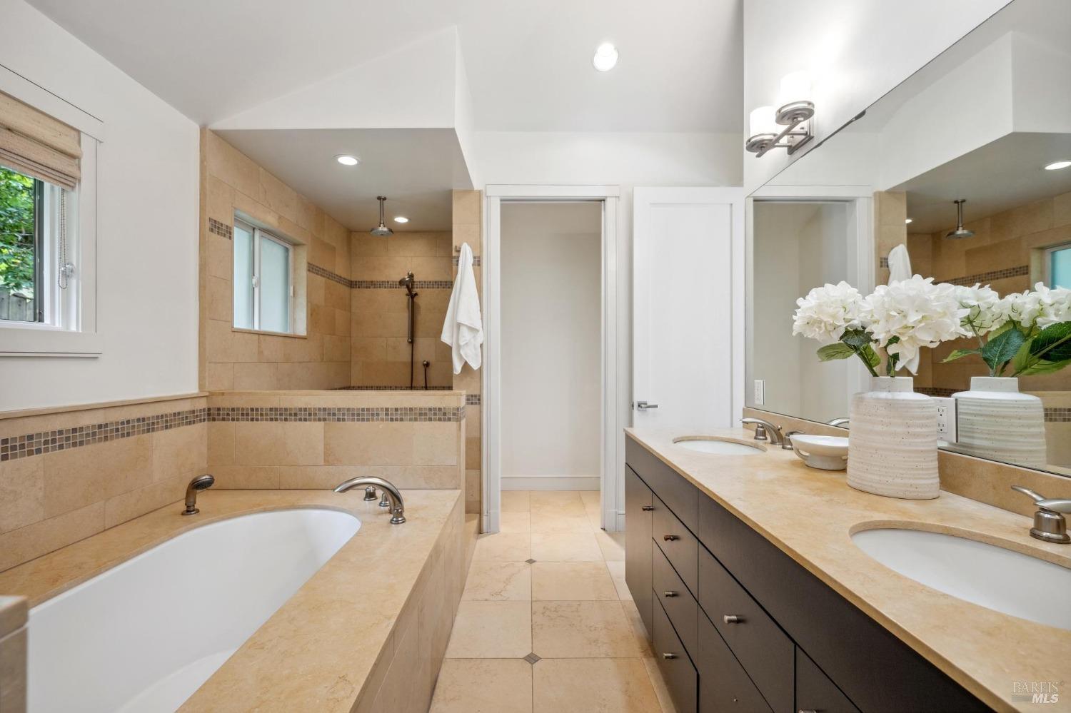 402 Eldridge Avenue Mill Valley, CA 94941 - Photo 33 of 49 a spacious bathroom with a granite countertop tub sink and mirror