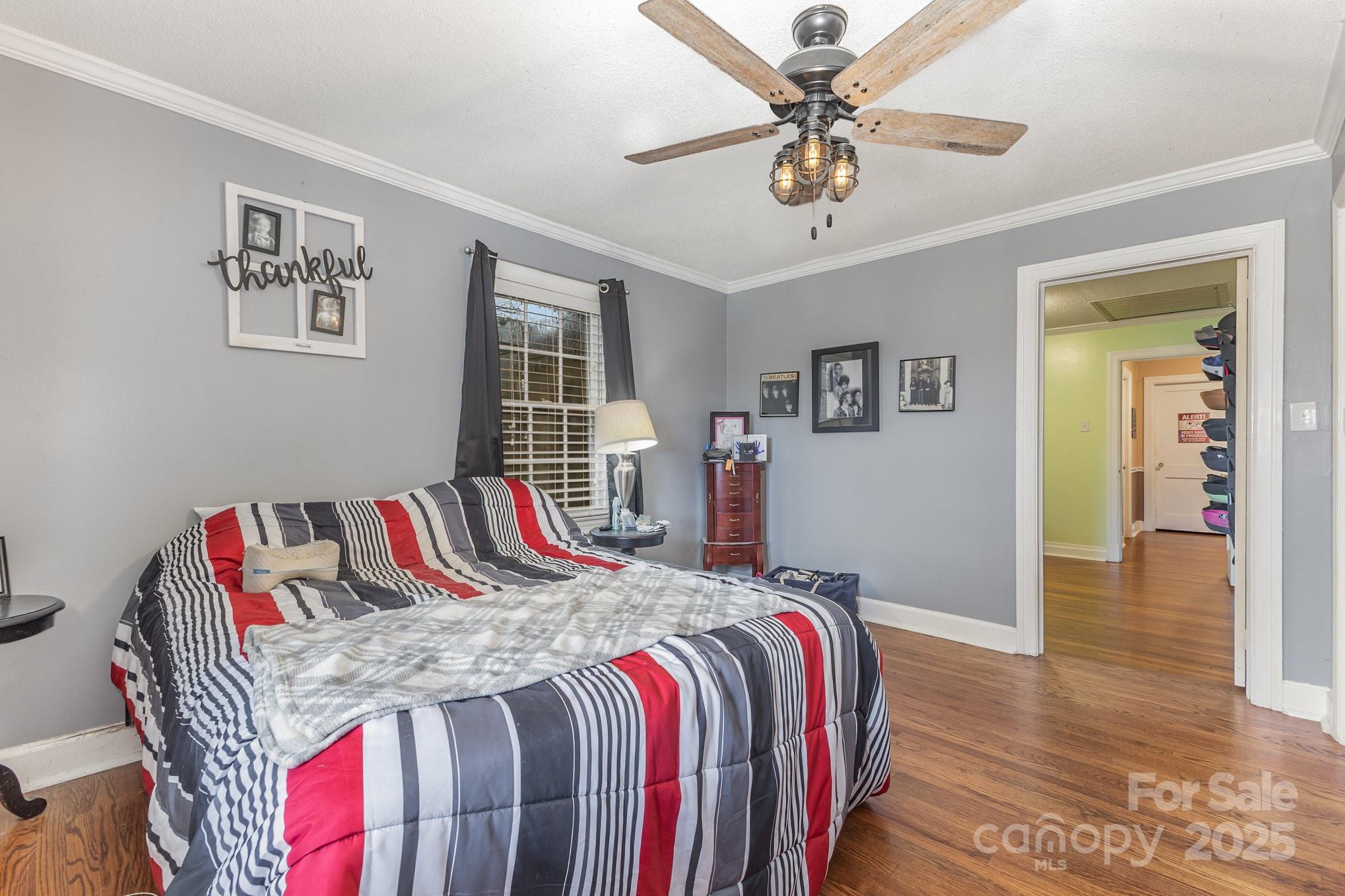 165 Bailey Road Lancaster, SC 29720 - Photo 11 of 33 a bedroom with a bed and a chandelier
