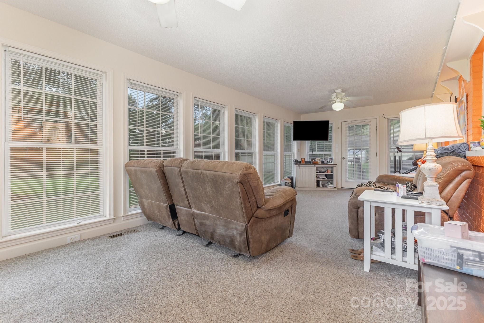 165 Bailey Road Lancaster, SC 29720 - Photo 23 of 33 a living room with furniture and a flat screen tv