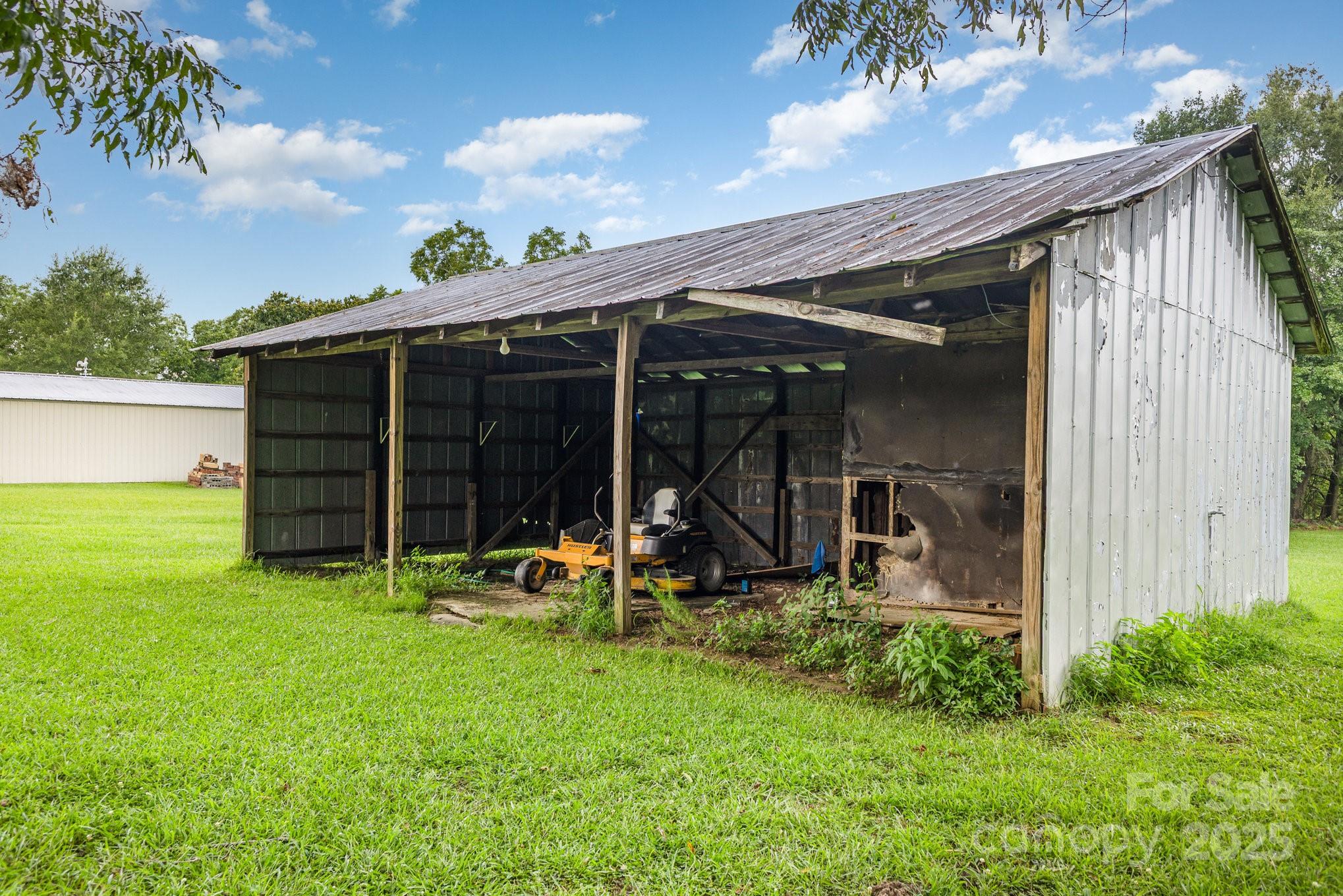 165 Bailey Road Lancaster, SC 29720 - Photo 29 of 33 a view of a backyard with chairs and a large tree