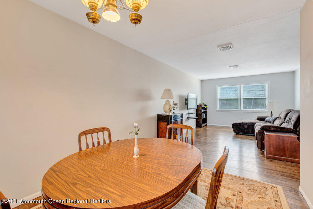 139 Queen Ann Road Brick, NJ 08723 - Photo 11 of 35 a dining room with furniture and wooden floor