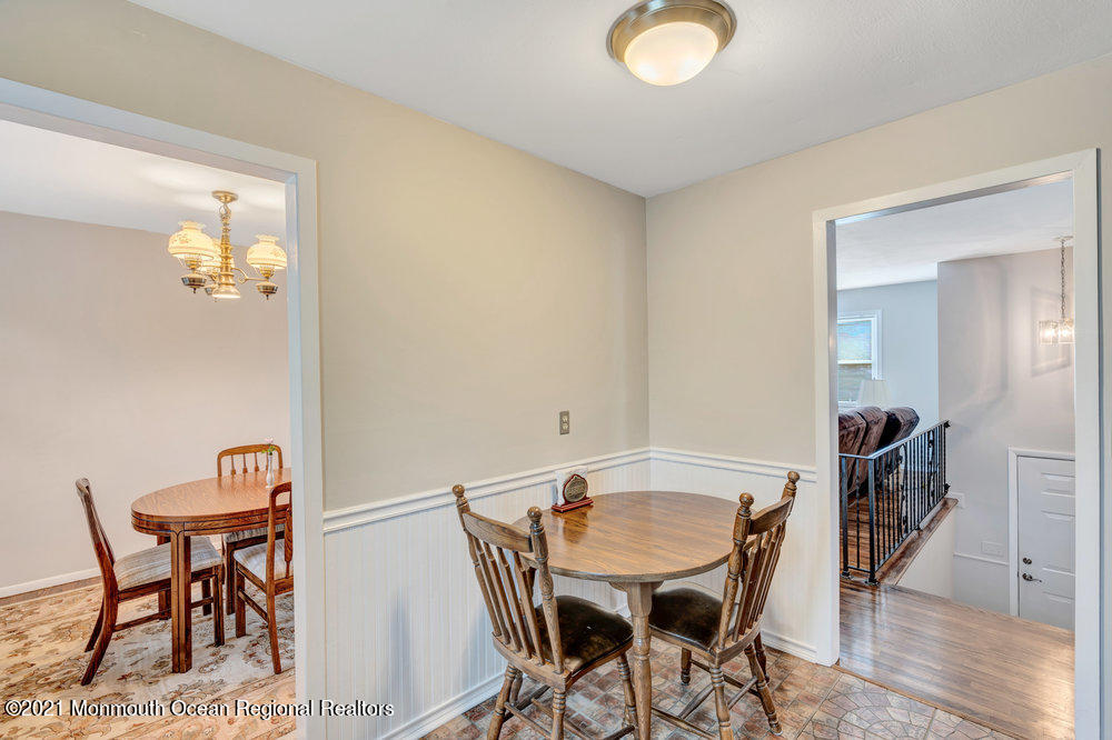 139 Queen Ann Road Brick, NJ 08723 - Photo 13 of 35 a view of a dining room with furniture and wooden floor