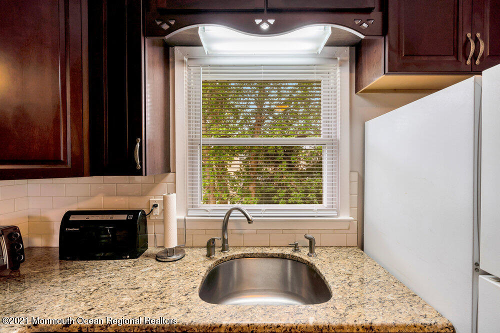 139 Queen Ann Road Brick, NJ 08723 - Photo 15 of 35 a kitchen with a sink and a window