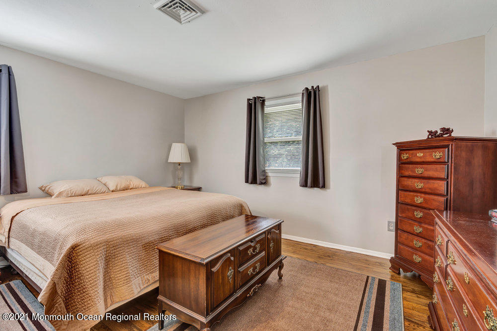 139 Queen Ann Road Brick, NJ 08723 - Photo 19 of 35 a bedroom with a bed and dresser