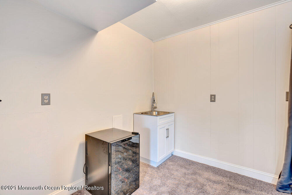 139 Queen Ann Road Brick, NJ 08723 - Photo 25 of 35 a living room with furniture and a table