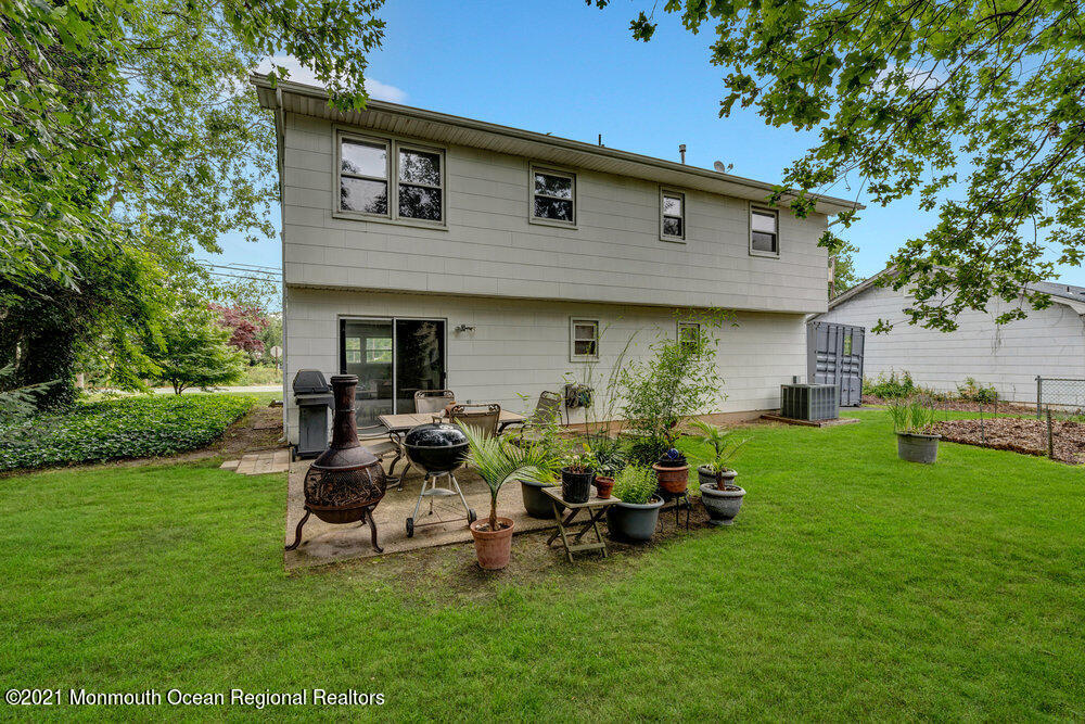 139 Queen Ann Road Brick, NJ 08723 - Photo 30 of 35 a view of a house with backyard sitting area and garden