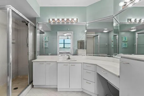 a spacious bathroom with a sink double vanity and a mirror