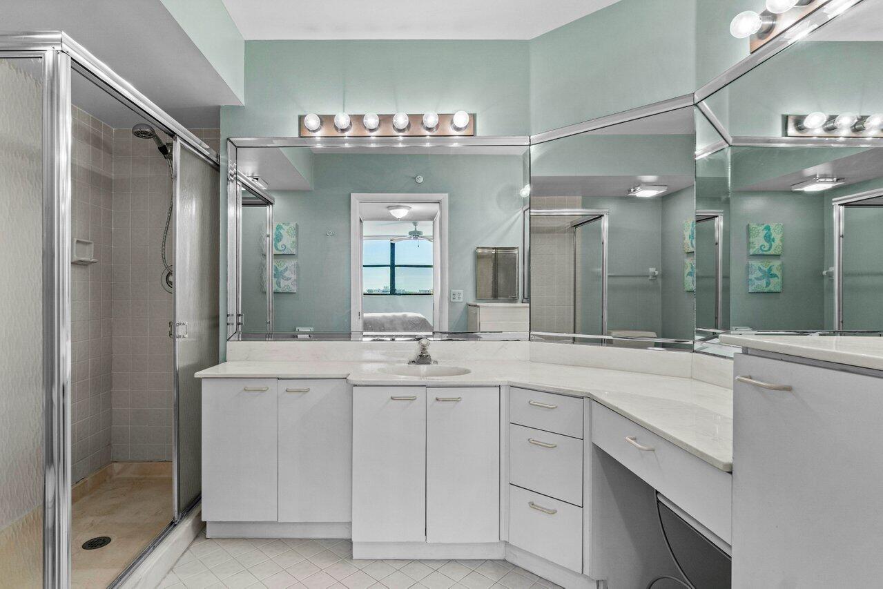 6530 Boca Del Mar Drive, Unit 735 Boca Raton, FL 33433 - Photo 21 of 38 a bathroom with a sink vanity and mirror