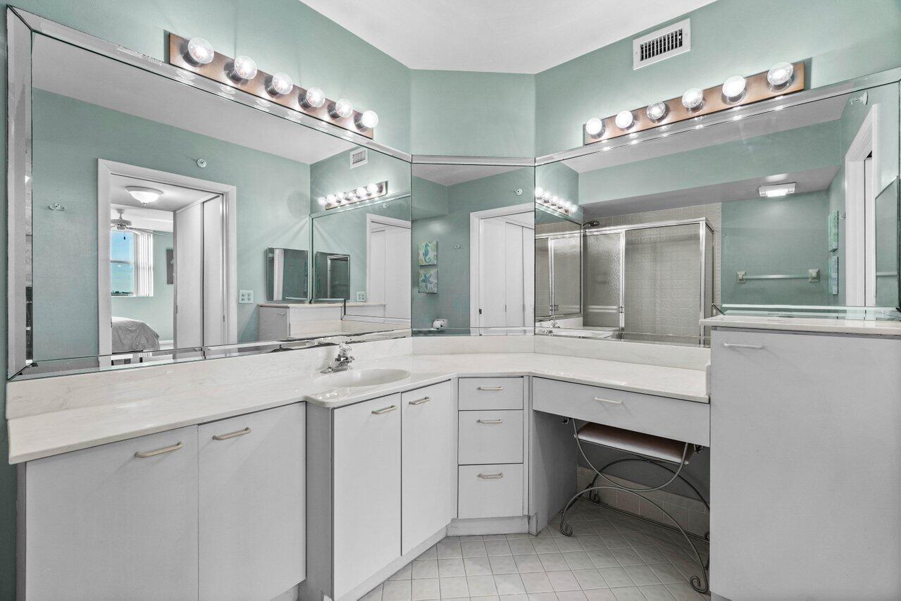 6530 Boca Del Mar Drive, Unit 735 Boca Raton, FL 33433 - Photo 22 of 38 a spacious bathroom with a sink double vanity and a mirror