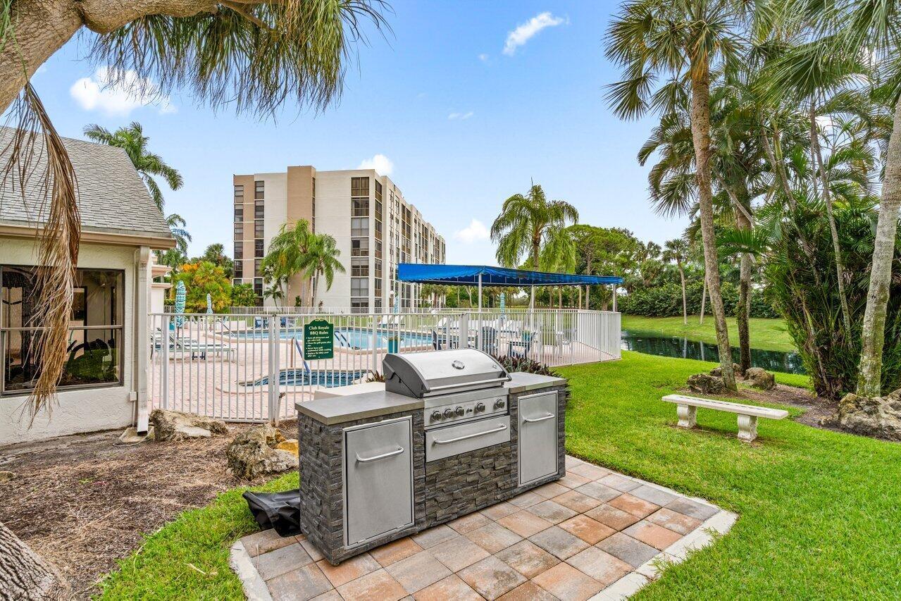 6530 Boca Del Mar Drive, Unit 735 Boca Raton, FL 33433 - Photo 37 of 38 a view of a house with backyard and sitting area