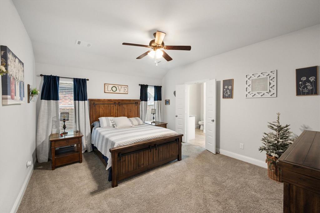 103 Randal Row Corsicana, TX 75110 - Photo 21 of 35 a bed room with a bed and a ceiling fan