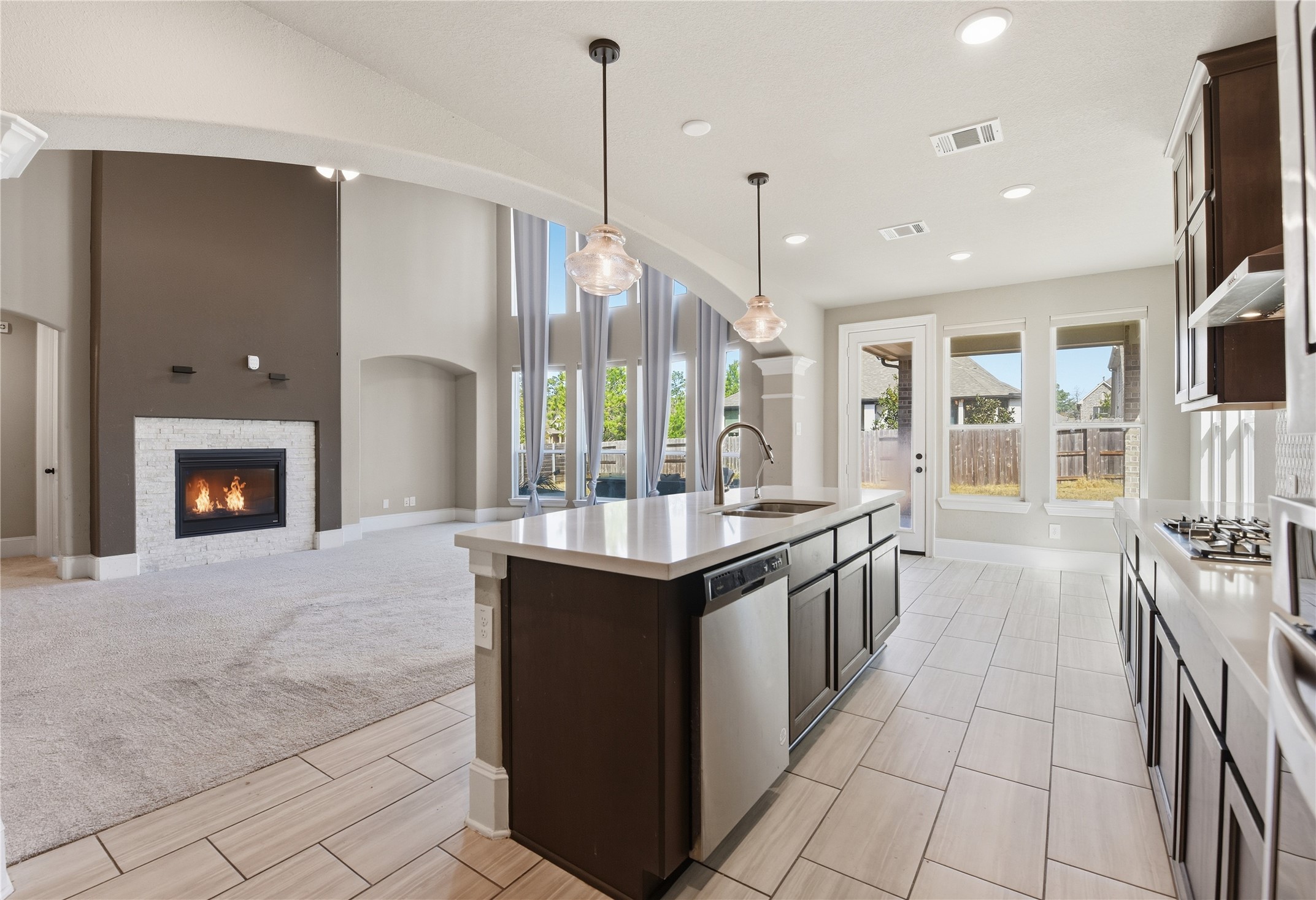 17501 Spice Merlot Lane Conroe, TX 77302 - Photo 19 of 50 a kitchen with stainless steel appliances granite countertop a stove and a sink