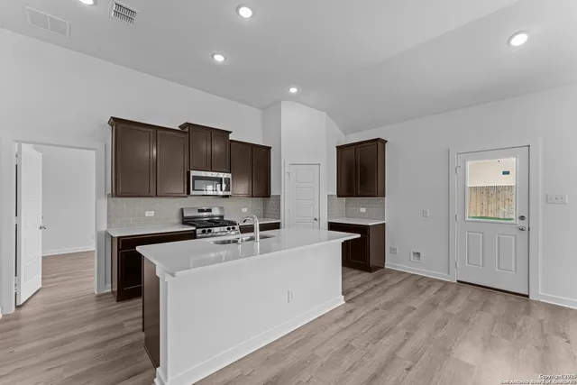 a bed room with a bed and windows