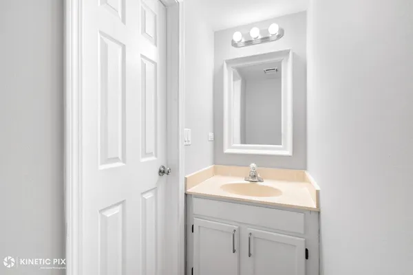 a bathroom with a sink a vanity and a mirror