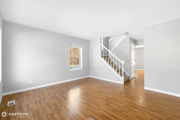 a view of an entryway with wooden floor