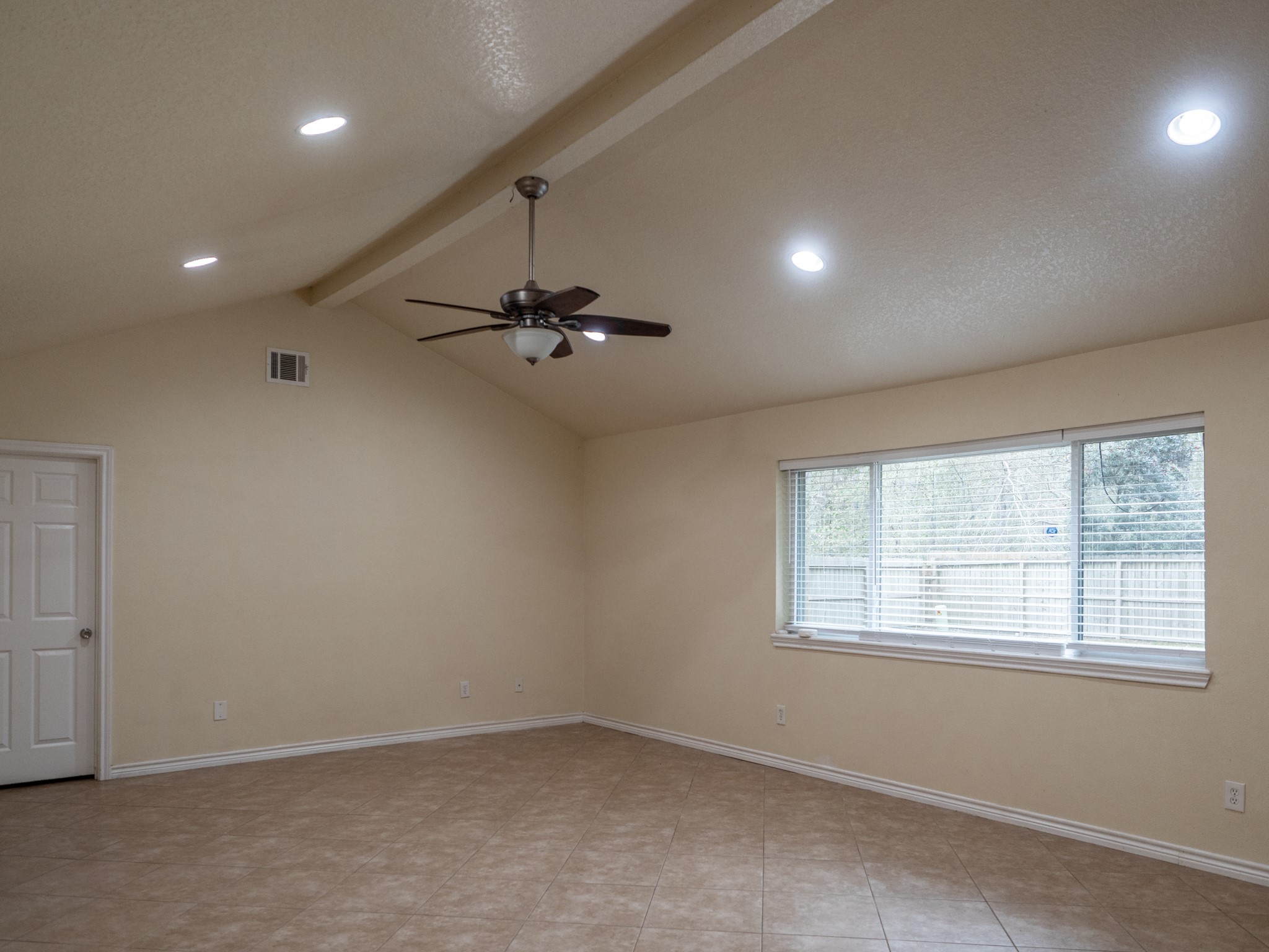 3302 Willie Way Spring, TX 77380 - Photo 12 of 28 an empty room with windows and fan