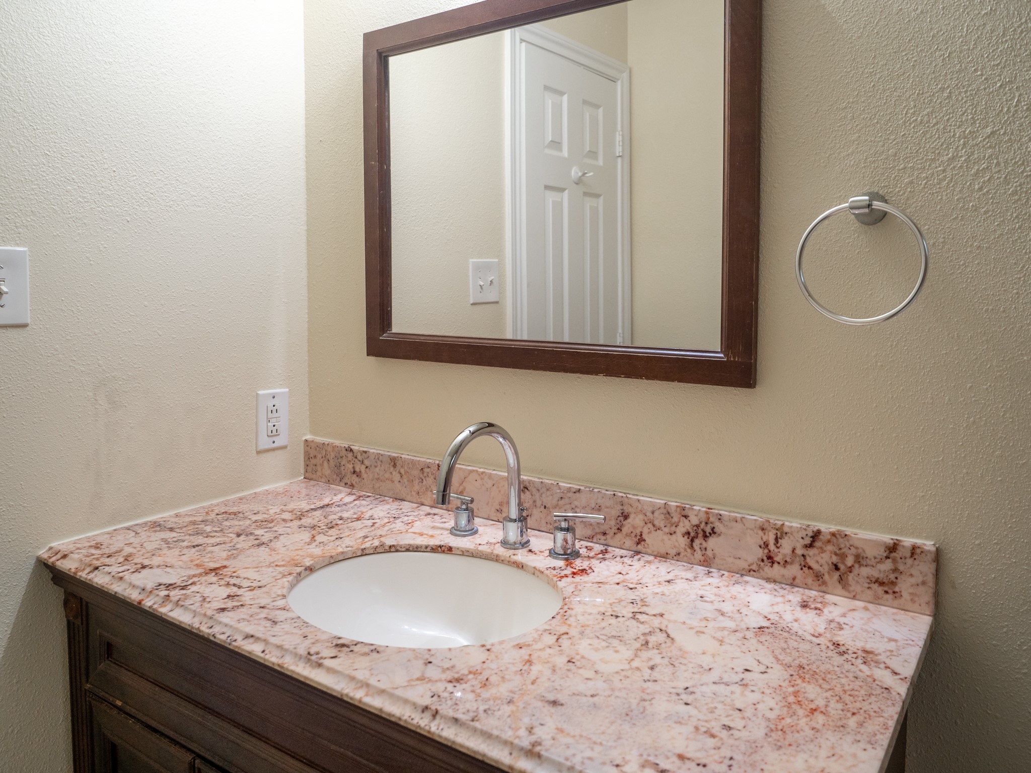 3302 Willie Way Spring, TX 77380 - Photo 19 of 28 a bathroom with a granite countertop sink and a mirror
