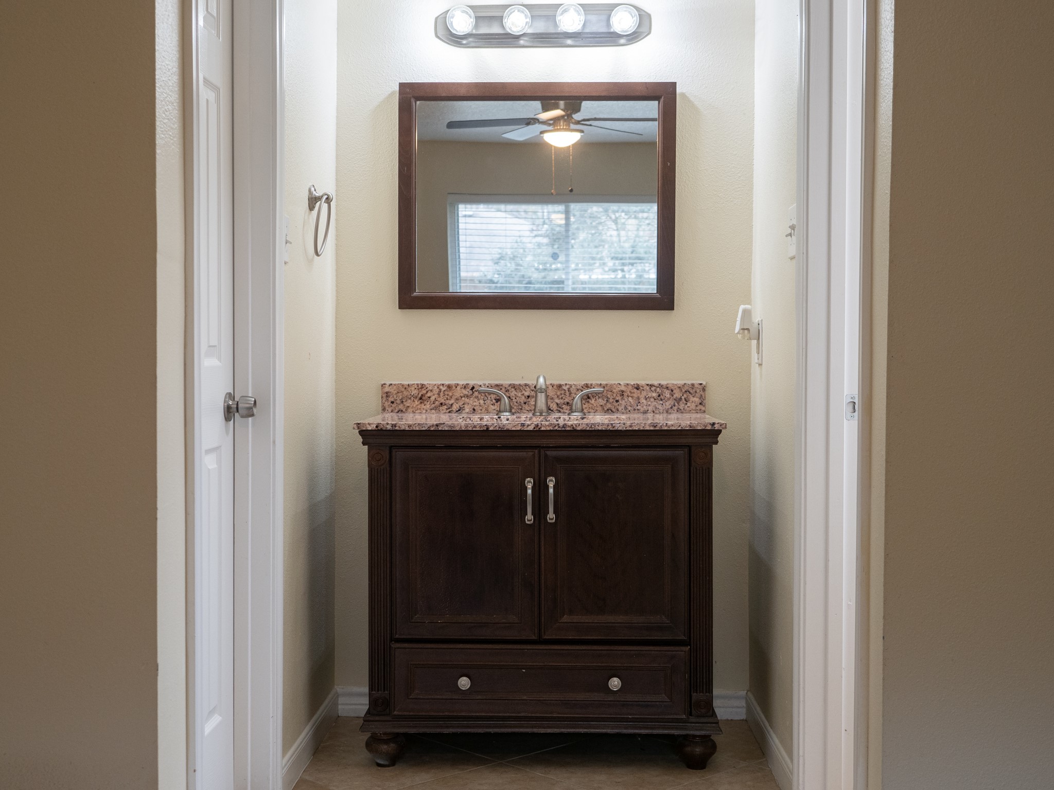 3302 Willie Way Spring, TX 77380 - Photo 20 of 28 a bathroom with a granite countertop and a sink