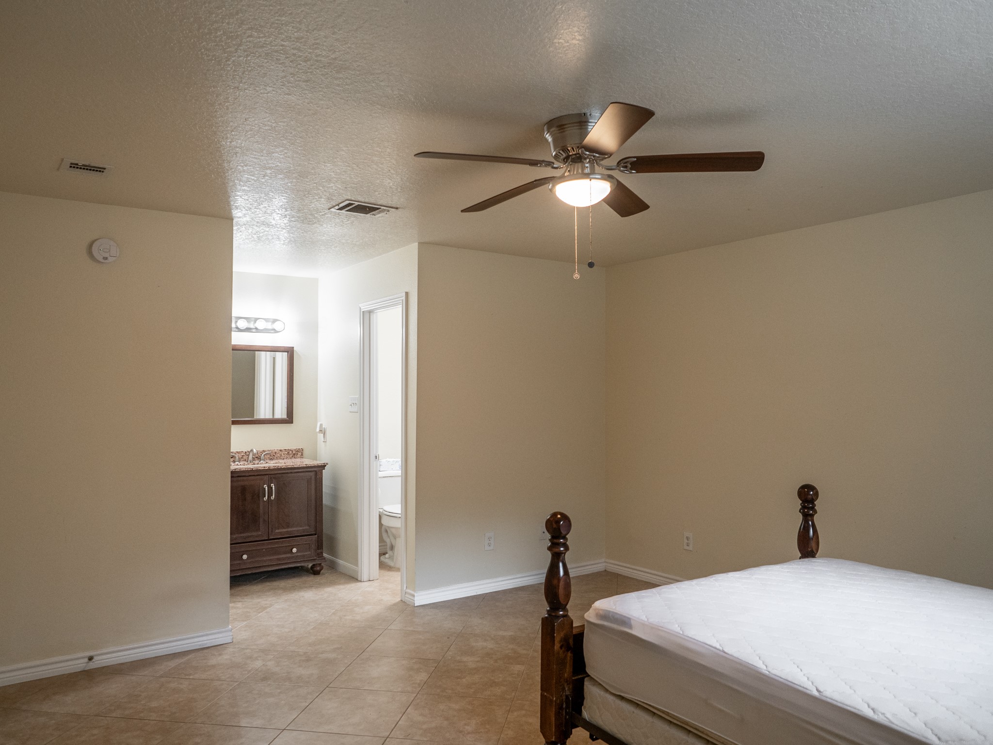 3302 Willie Way Spring, TX 77380 - Photo 22 of 28 a bedroom with a bed and a ceiling fan
