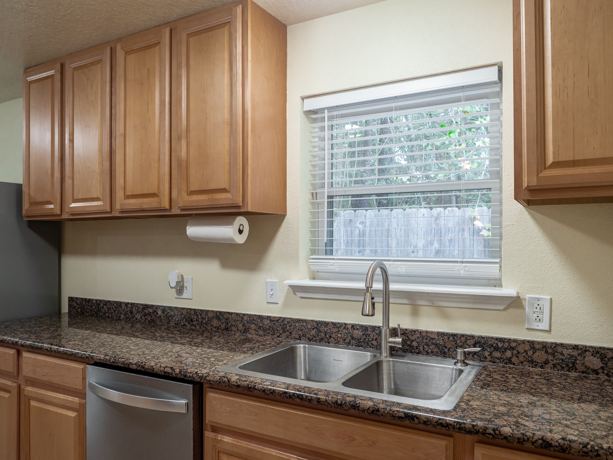 3302 Willie Way Spring, TX 77380 - Photo 5 of 28 a kitchen with granite countertop a sink and cabinets