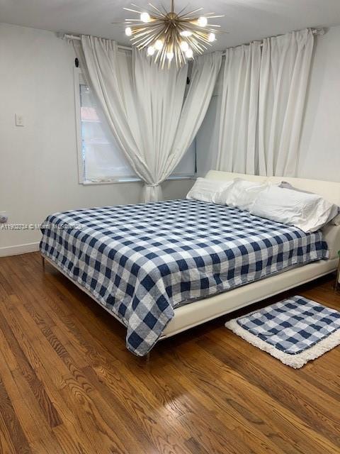 200 Northeast 48th Terrace Miami, FL 33137 - Photo 11 of 20 a bedroom with a bed table and window