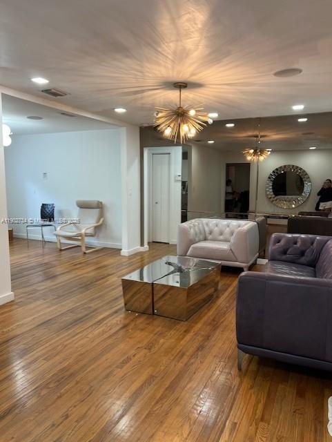 200 Northeast 48th Terrace Miami, FL 33137 - Photo 15 of 20 a living room with furniture and a wooden floor