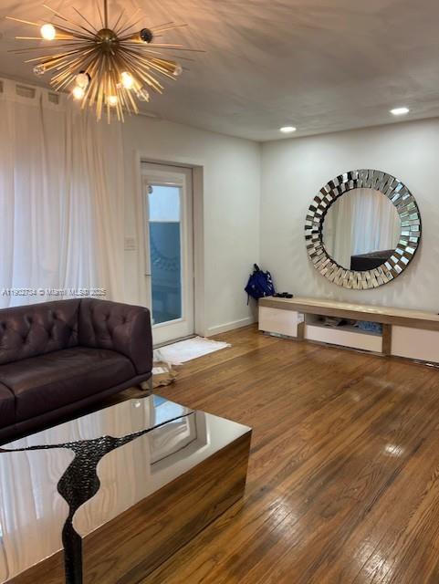 200 Northeast 48th Terrace Miami, FL 33137 - Photo 3 of 20 a living room with furniture and a wooden floor
