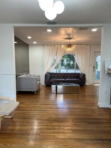 a living room with couch and a table