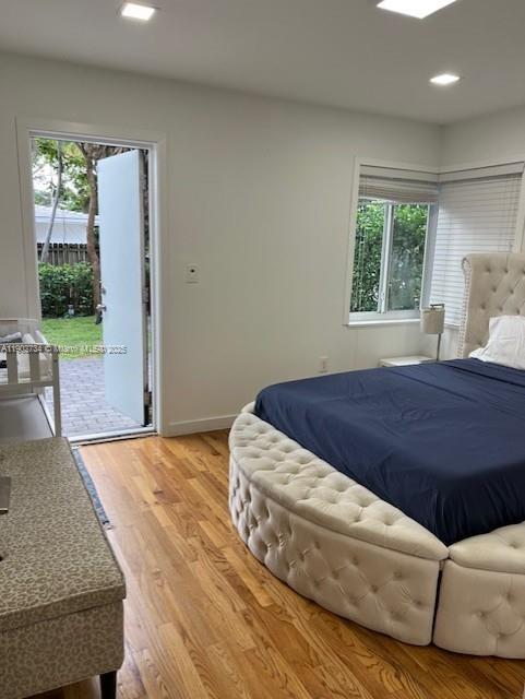 200 Northeast 48th Terrace Miami, FL 33137 - Photo 6 of 20 a bedroom with a bed cabinet and window