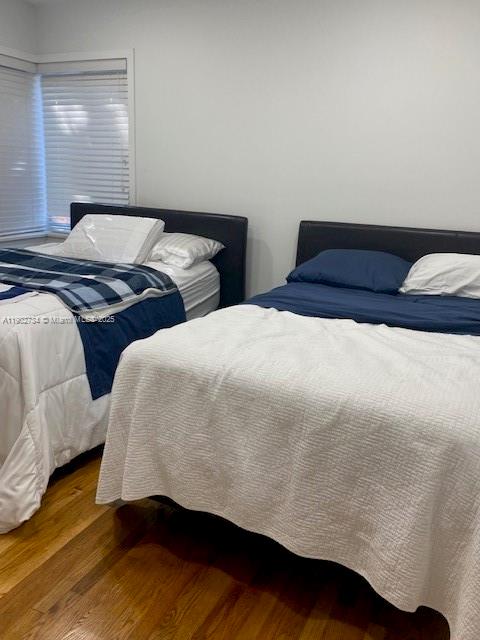 200 Northeast 48th Terrace Miami, FL 33137 - Photo 9 of 20 a bedroom with two bed and a night stand