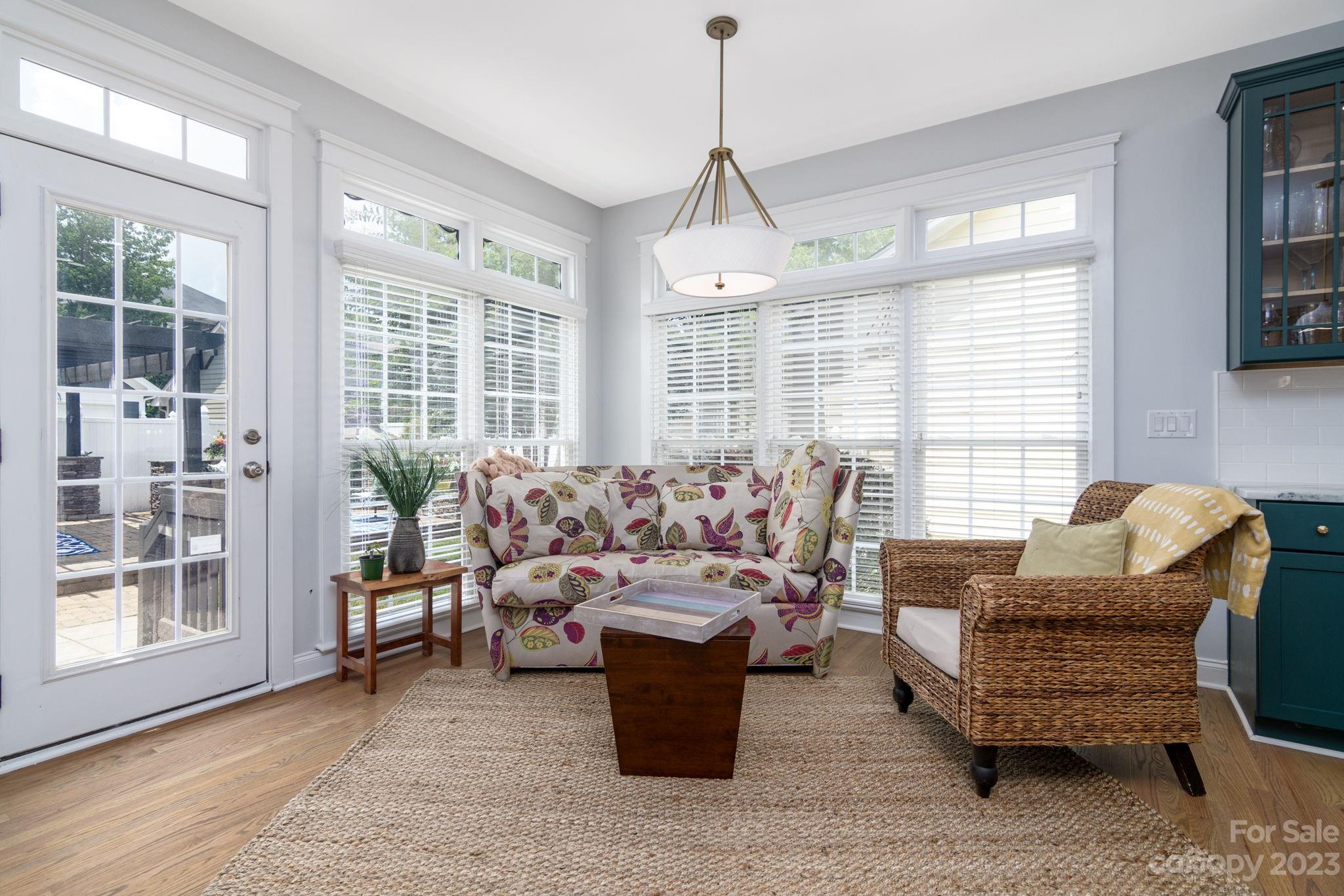 882 Promenade Walk Fort Mill, SC 29708 - Photo 11 of 48 a living room with furniture and a chandelier