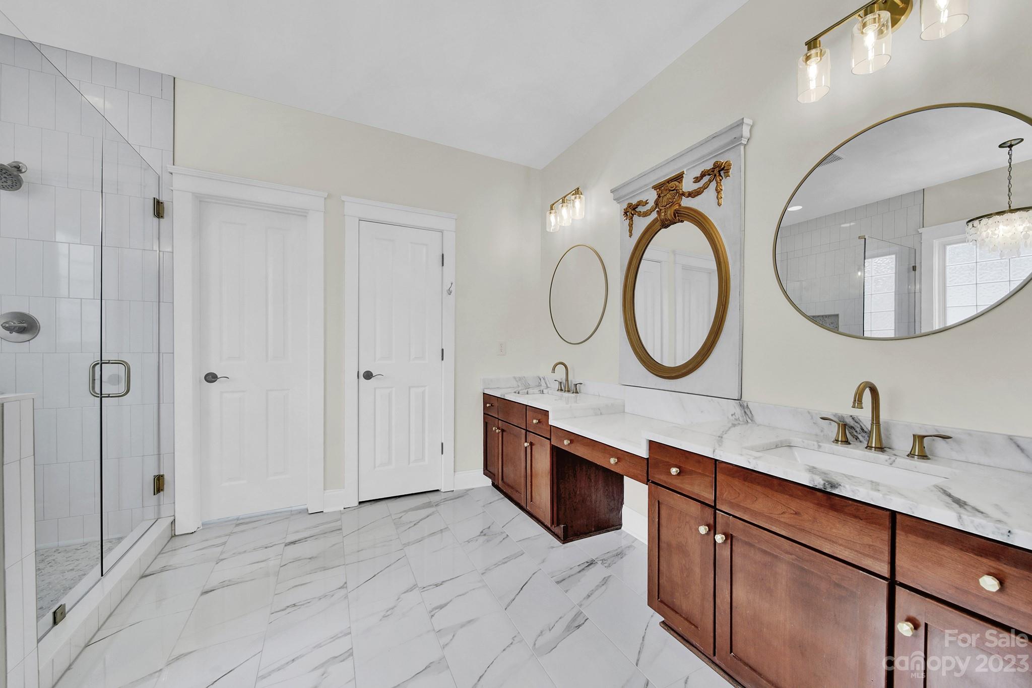 882 Promenade Walk Fort Mill, SC 29708 - Photo 16 of 48 a bathroom with a double vanity sink mirror and bathtub