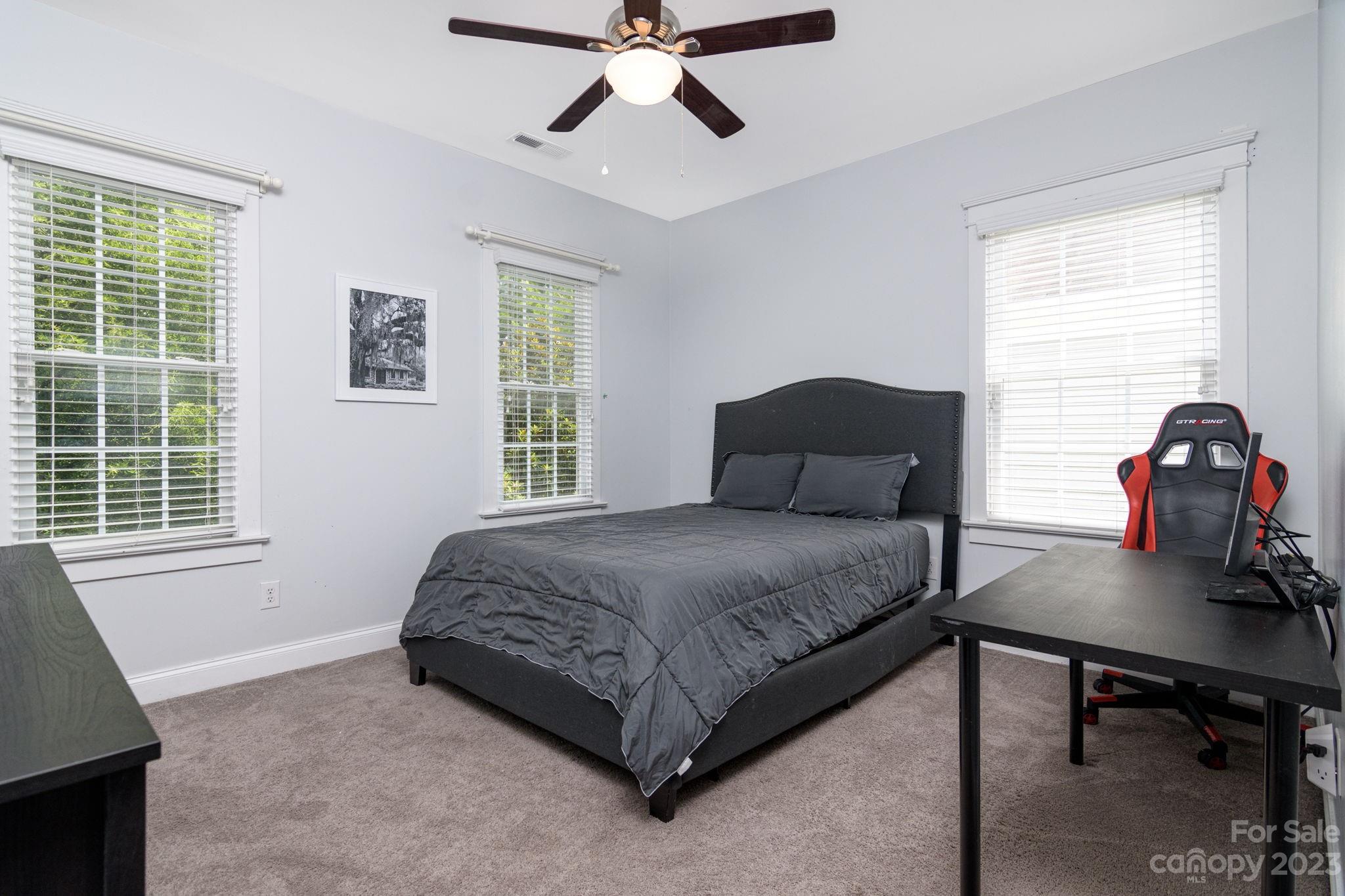 882 Promenade Walk Fort Mill, SC 29708 - Photo 19 of 48 a bedroom with a bed and a window