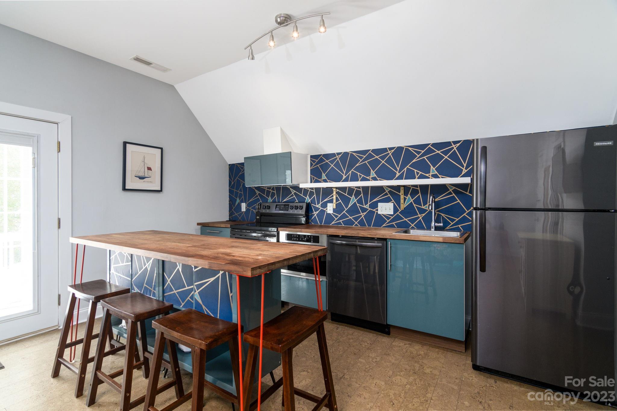 882 Promenade Walk Fort Mill, SC 29708 - Photo 25 of 48 a view of kitchen with stainless steel appliances granite countertop a table and chairs