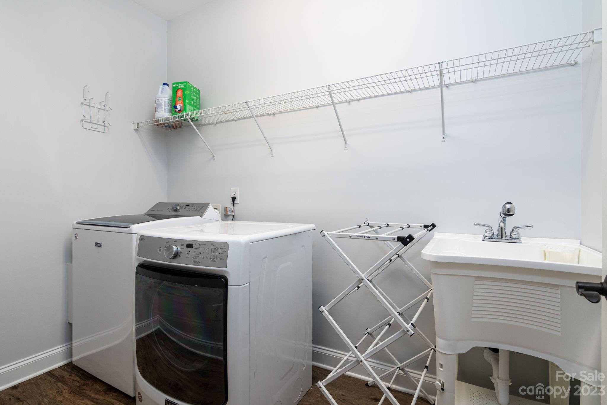 882 Promenade Walk Fort Mill, SC 29708 - Photo 27 of 48 a utility room with a sink dryer and washer