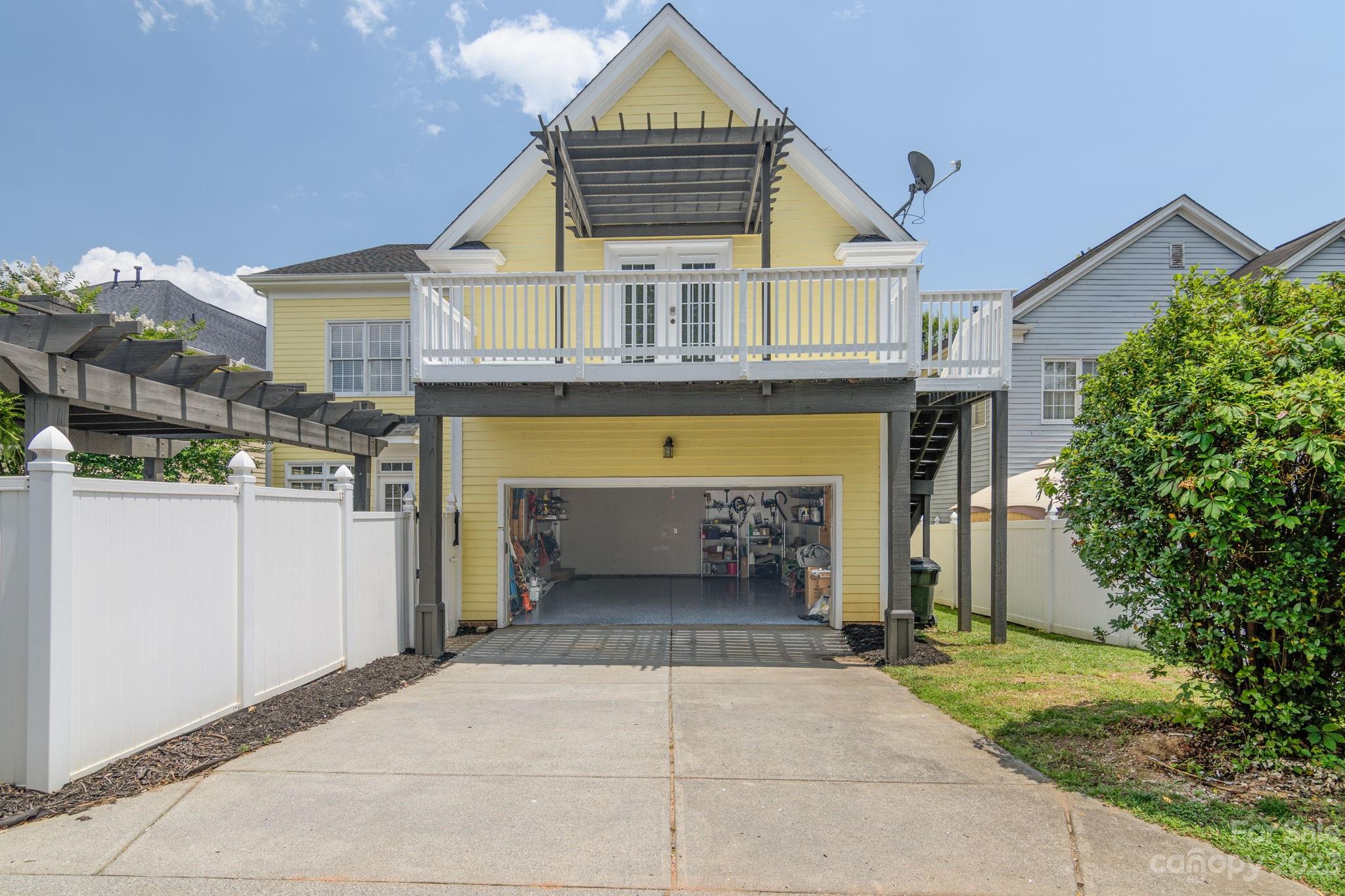 882 Promenade Walk Fort Mill, SC 29708 - Photo 30 of 48 a front view of a house with a yard and garage