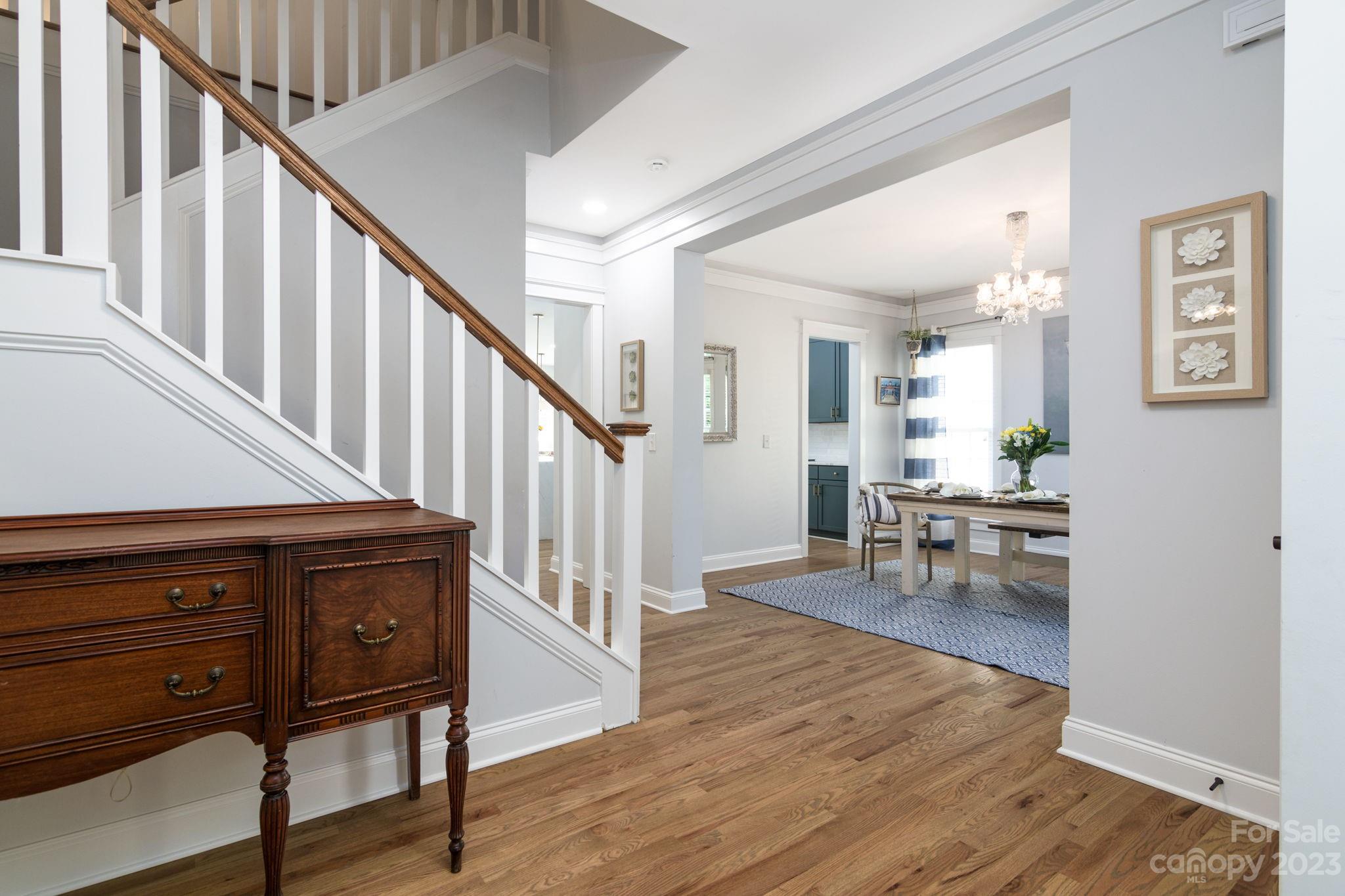 882 Promenade Walk Fort Mill, SC 29708 - Photo 5 of 48 a living room with wooden floors and a furniture