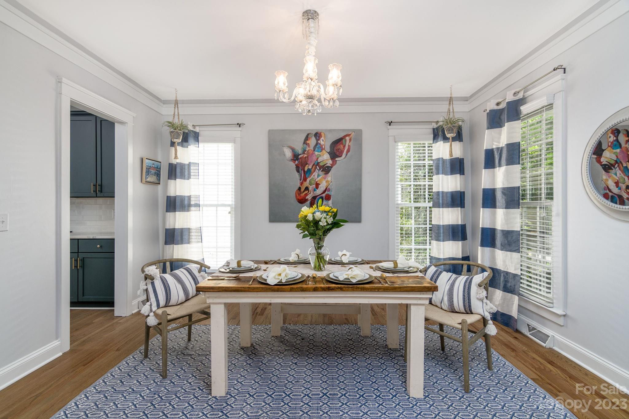882 Promenade Walk Fort Mill, SC 29708 - Photo 7 of 48 a living room with furniture a chandelier and a table