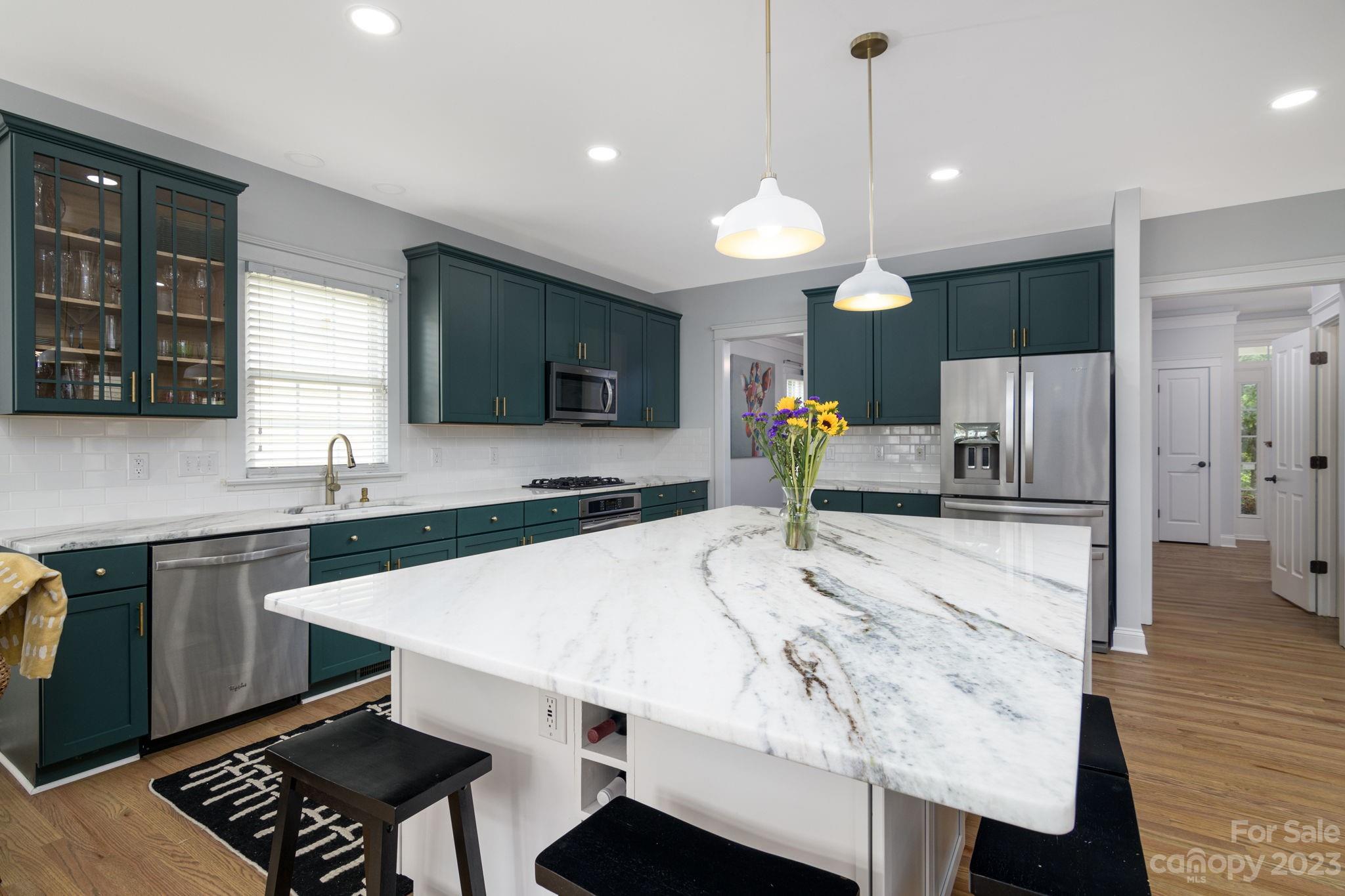 882 Promenade Walk Fort Mill, SC 29708 - Photo 10 of 48 a large kitchen with kitchen island a sink stainless steel appliances and cabinets
